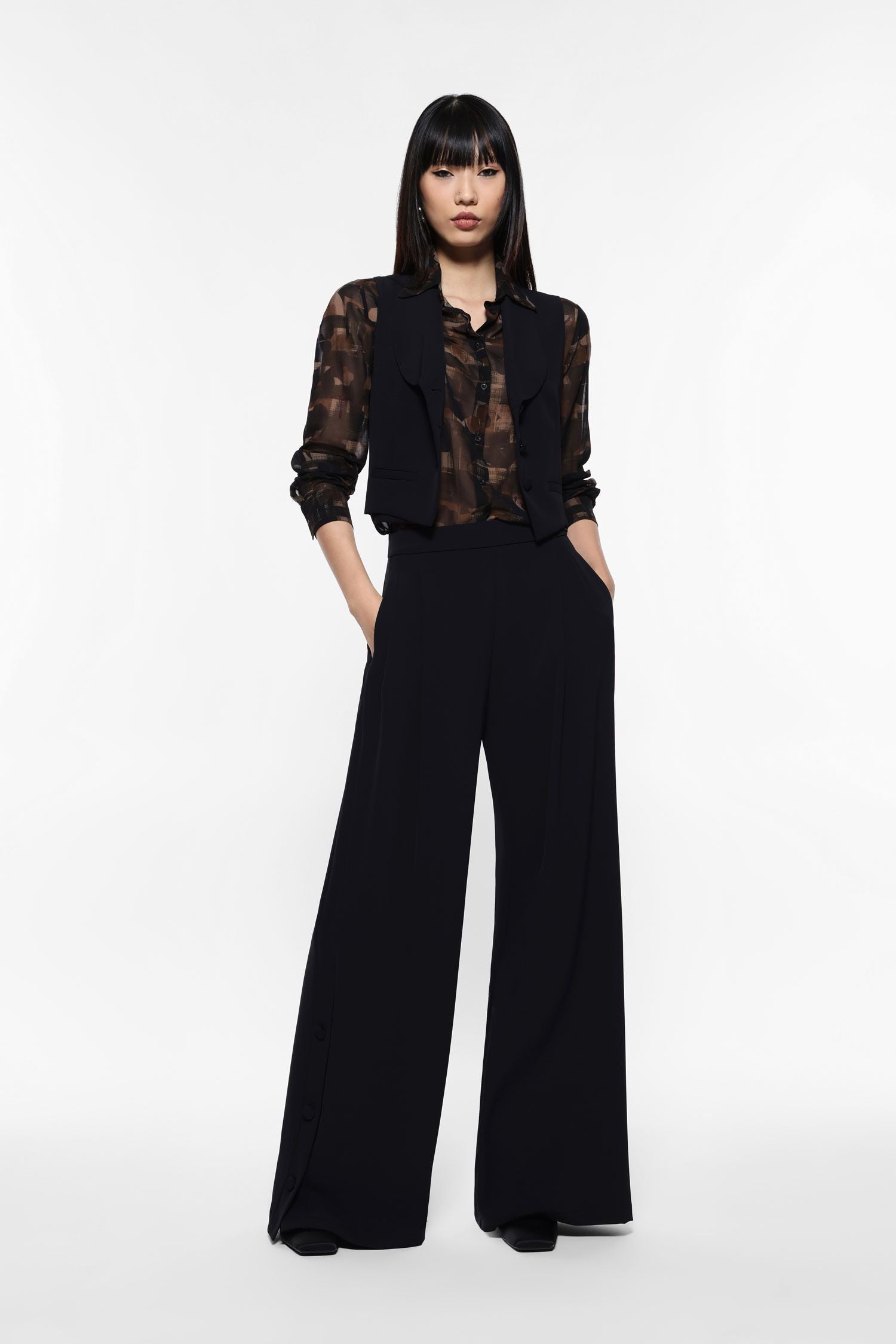 Wide-leg trousers with side buttons